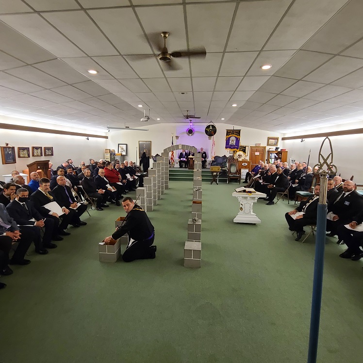 View of Massachusetts Grand Lodge filled with veteran Brothers and new members of the Craft